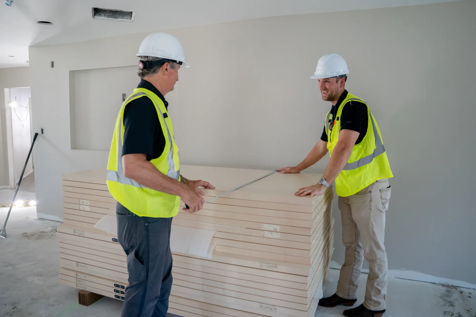Two Pristine team members coordinating door installation
