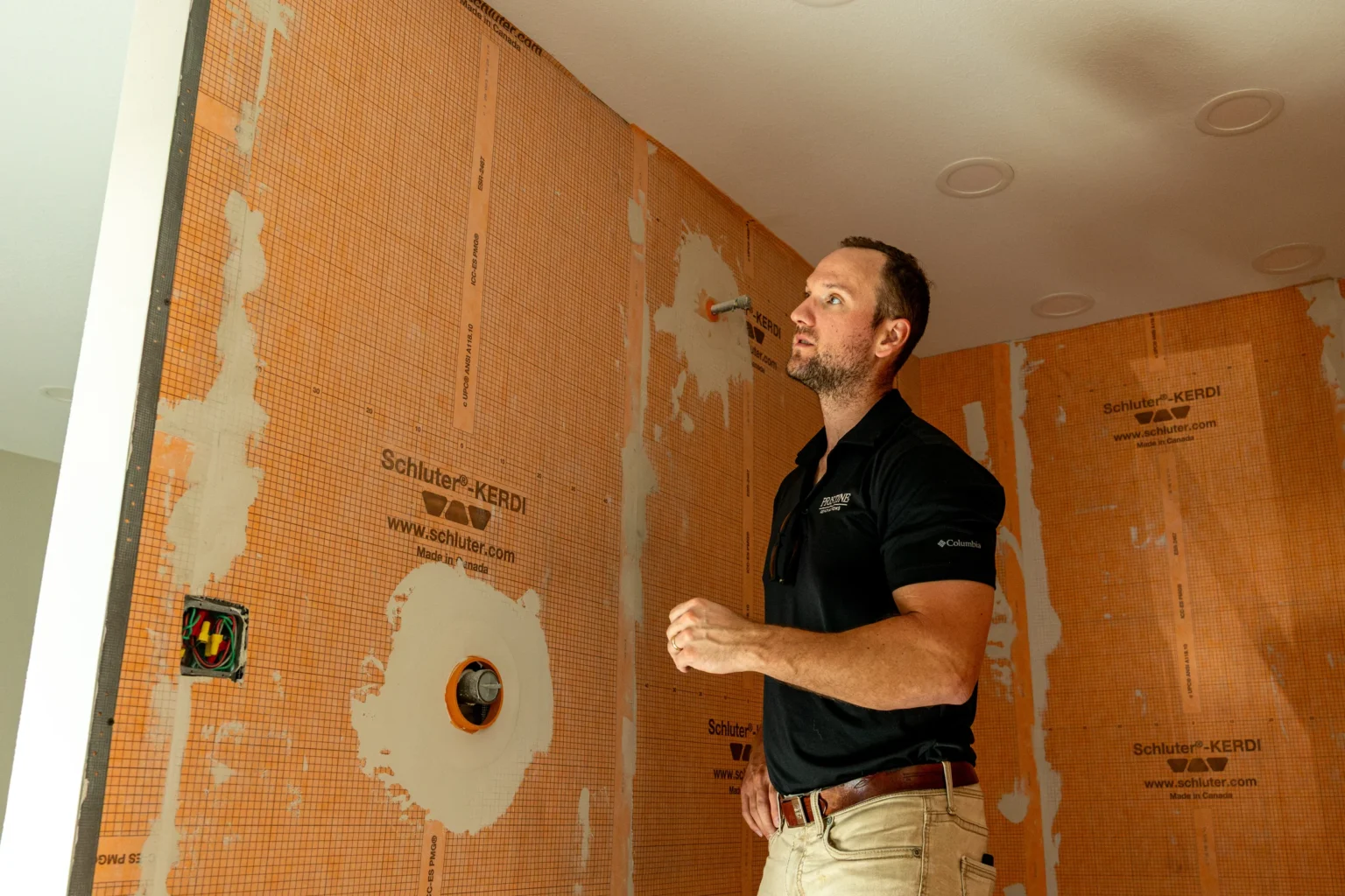 Pristine team member checking wall preparation and surface finish